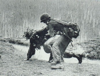 A 1st Cav trooper helping wounded brother.jpg